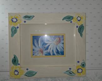 This is a vintage matted print of blue and white daisies housed in a hand-painted wooden frame