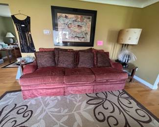 Red Velvet Sofa with Paisley Pillows