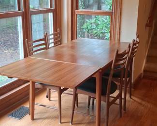 Danish Teak Extendable Dining Table with Chairs and Assorted Tableware second image
