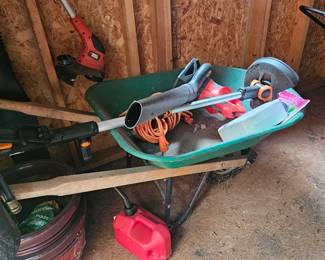 Wheel barrel with weed Wacker and trimmer