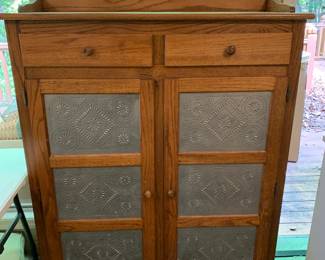 #8	oak and punched tin 2 drawer 2 door cabinet 42x14x53	 $125.00 