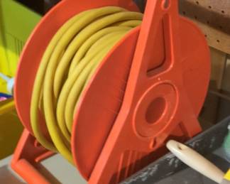 Orange Plastic Garden Hose Reel with Yellow Hose