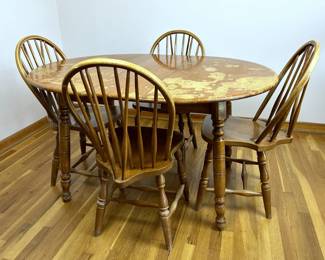 Vintage 1950s Early American Style maplewood table with four matching Windsor chairs by St. John's Table Company of Cadillac, Michigan. 