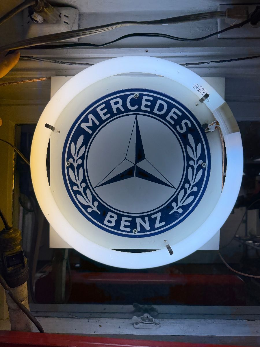 Porcelain enamel Mercedes sign with fluorescent tube. 