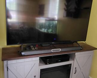 Great TV stand with built in fireplace and large samsung HDTV with Polk audio system