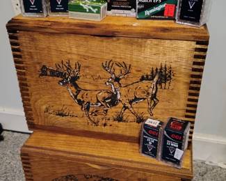 Vintage ammo boxes with painted deer and assortment of .22 caliber and 9mm ammunition