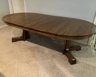 Oak table with split pedestal, extends to 93" with two 24" leaves