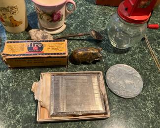 Old compact, Hire's root beer bottle in box, Buffalo nickle coaster
