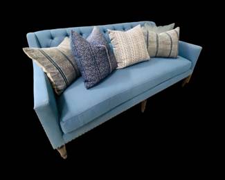 Blue tufted sofa