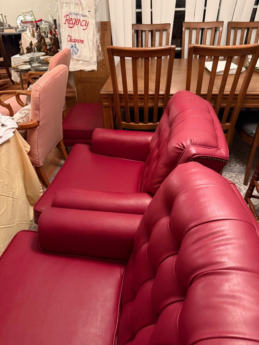 Pair of leather chairs with matching ottoman