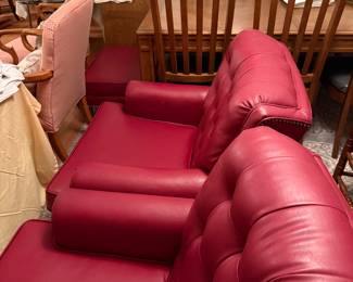 Pair of leather chairs with matching ottoman