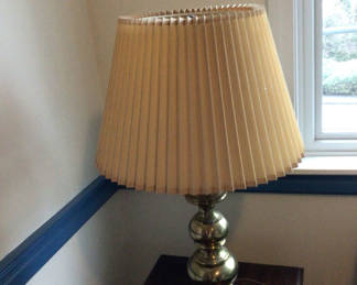 Lot 71: Brass lamp with pleated beige shade