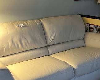 Lot 53: Beige leather sofa 78”