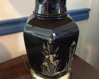 Lot 74: Black ceramic table lamp with floral motif and pleated shade