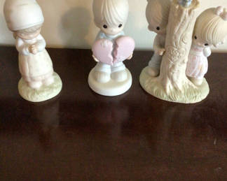 Lot 112: Precious Moments Pastel ceramic children's figurine set
