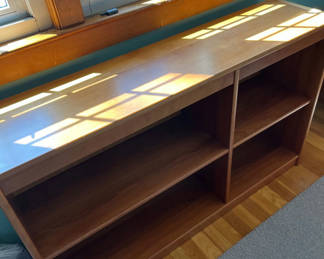 Lot 121: Wooden long console with top surface and open cubby storage