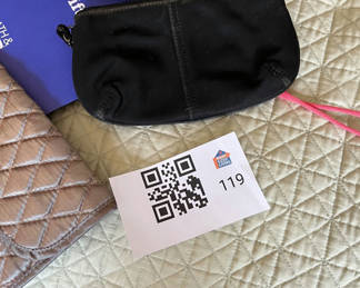 Lot 119: Assorted handbags, wallets, and pouches