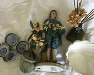 Lot 128: Decorative ceramic figurine, planters, blue-and-white dishware, and a reed diffuser