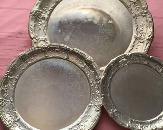 Lot 16: Set of three ornate embossed metal plates