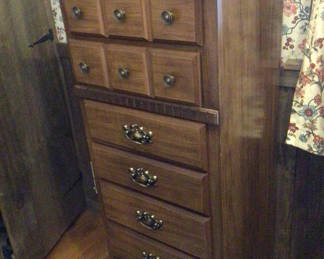 Lot 139: Tall wooden dresser with multiple drawers