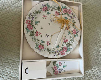 Lot 122: Floral porcelain cake plate with matching small porcelain knife