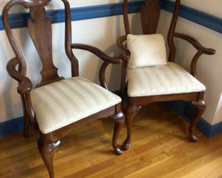 Lot 69: Pair of carved wooden armchairs with upholstered seats