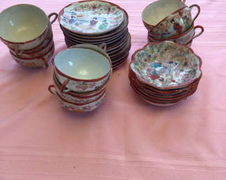 Lot 50: Japanese porcelain teacups, saucers and small plates