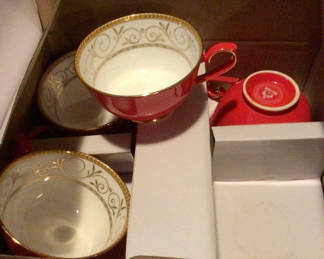 Lot 383: Red bone china tea set with teapot and cups