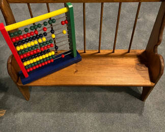 Lot 174: Wooden doll bench with colorful abacus