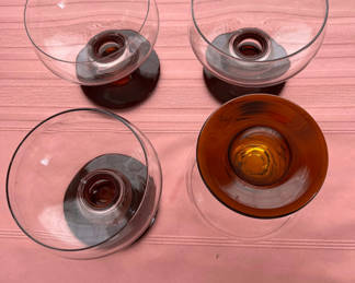 Lot 47: Set of Four Glass Stick Candle Holders