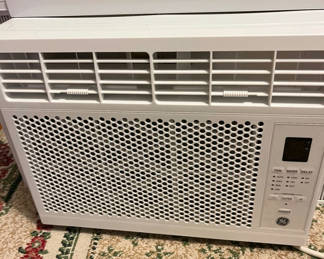 Lot 89: White GE window air conditioner with remote