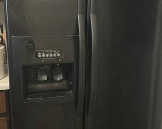 Lot 244: Whirlpool side-by-side refrigerator with ice and water dispenser
