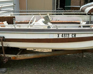 Lot 131: Aluminum fishing boat on trailer with outboard motor
