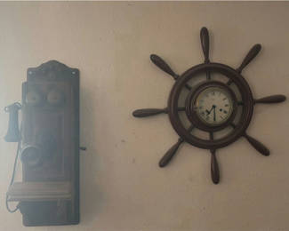 Lot 216: Vintage wall-mounted ship wheel clock, antique telephone, and wooden wall rack