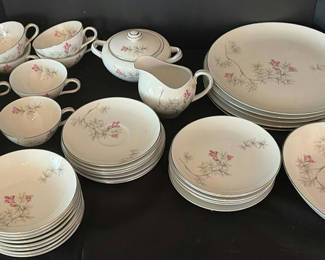 Lot 291: Porcelain dinnerware set with pink floral bamboo motif
