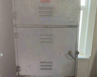 Lot 209: Tall metal utility cabinet with tools and hardware