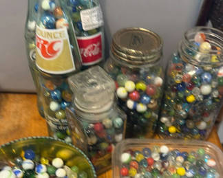 Lot 132: Assorted glass marbles in jars, bowls, and bottles