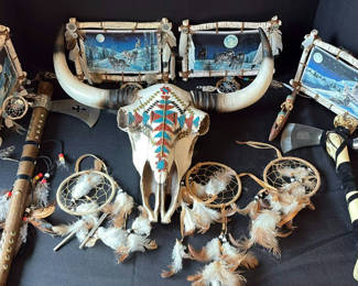 Lot 14: Decorative Native American-inspired skulls, wolf-themed wall art, dreamcatchers, and beaded tomahawk