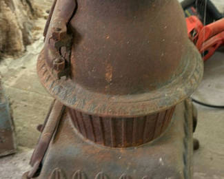Lot 125: Antique cast-iron pot-bellied stove