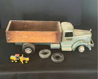 Lot 219: Vintage metal toy trucks with wooden flatbed and accessories