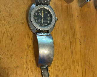 Lot 266: Vintage metal cuff watch and engraved bracelet cuffs