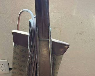 Lot 34: Two Upright Vacuums, a Vintage Lantern, and Metal Tool Stands