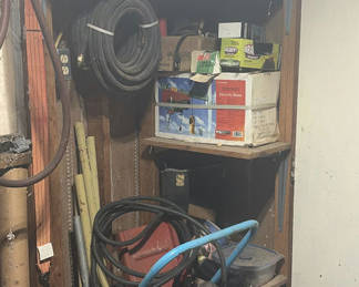 Lot 234: workshop tools with hoses, cords, and hardware