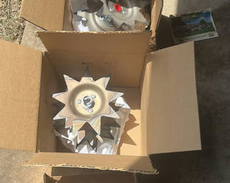 Lot 233: Star-shaped metal impeller wheels in boxes