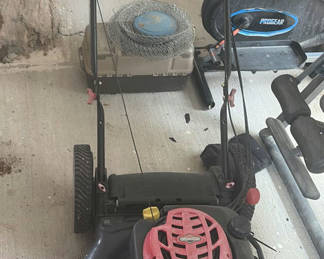 Lot 212: Gas-powered Troy-Bilt 21-inch lawn mower with spare parts