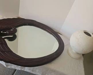 A Wood Swan Mirror And A Vase Made In Portugal