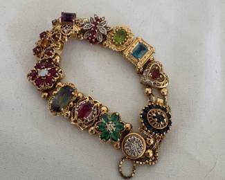 14 karat gold with massive precious gems, tested