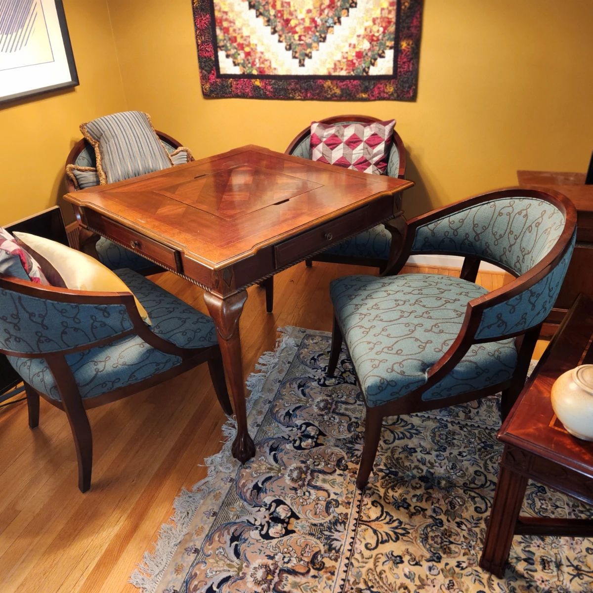carved gaming table with 4 chairs