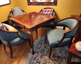 carved gaming table with 4 chairs
