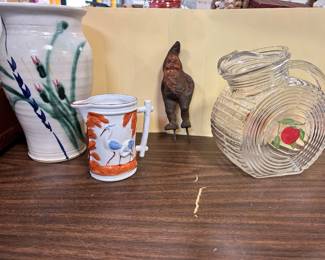 On the left - Art Pottery floral vase by Refabulousby Wendy,  a blue herring creamer,  a cast-iron garden gnome and 1950s tilt carafe pitcher.